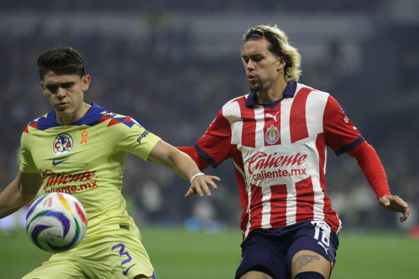 MEXICO CITY, MEXICO - 2024/05/19: Cade Cowell #16 of Chivas de Guadalajara and Israel Reyes #3 of Club América battle for the ball during the Mexican Clausura tournament semifinal second leg  of the Liga MX. America beats Chivas 1 to 0, the aggregate score was 1-0 with Club America going through to the finals. (Photo by Ismael Rosas/Eyepix Group/LightRocket via Getty Images)